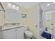 Bright bathroom with a vanity, toilet, and a shower-tub combination at 601 Retreat Beach Circle # 213, Pawleys Island, SC 29585
