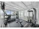 Bright gym with fitness equipment and large windows with pool view at 601 Retreat Beach Circle # 213, Pawleys Island, SC 29585