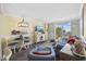 Open-concept living area with comfortable furniture, dining space, and coastal-inspired decor at 601 Retreat Beach Circle # 213, Pawleys Island, SC 29585