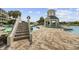 Community pool area with water features, a gazebo, and nearby stairway at 601 Retreat Beach Circle # 213, Pawleys Island, SC 29585