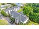 Aerial view of condos with lush green landscaping, parking, and a serene pond feature at 6016 Dick Pond Rd. # 109, Myrtle Beach, SC 29588