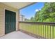 Outdoor balcony offering views of neighboring building and wooded landscape at 6016 Dick Pond Rd. # 109, Myrtle Beach, SC 29588