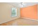 A bright and airy bedroom featuring hardwood floors and natural light from a large window at 6016 Dick Pond Rd. # 109, Myrtle Beach, SC 29588