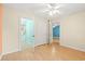 Bright bedroom with hardwood floors, a ceiling fan, and connecting doorways to other rooms at 6016 Dick Pond Rd. # 109, Myrtle Beach, SC 29588