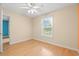 Bedroom with hardwood floors and natural light from a large window at 6016 Dick Pond Rd. # 109, Myrtle Beach, SC 29588