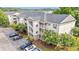 Inviting condo exterior with multiple units, private balconies, and well-maintained landscaping at 6016 Dick Pond Rd. # 109, Myrtle Beach, SC 29588