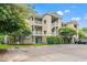 Multi-story condo building featuring outdoor stairwells and shaded parking at 6016 Dick Pond Rd. # 109, Myrtle Beach, SC 29588