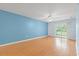 Spacious, open floor plan with hardwood floors and sliding glass doors to balcony at 6016 Dick Pond Rd. # 109, Myrtle Beach, SC 29588