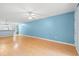 Clean and open living space featuring hardwood floors, fan and pass-through to kitchen at 6016 Dick Pond Rd. # 109, Myrtle Beach, SC 29588
