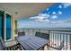 Spacious balcony featuring a table and chairs and offering stunning ocean views at 603 S Ocean Blvd. # 1205, North Myrtle Beach, SC 29582