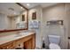 Cozy bathroom featuring a single sink vanity and a framed mirror at 603 S Ocean Blvd. # 1205, North Myrtle Beach, SC 29582