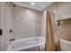 Classic white bathroom featuring tile surround and a bathtub with shower at 603 S Ocean Blvd. # 1205, North Myrtle Beach, SC 29582