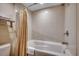 Classic white bathroom featuring tile surround and a bathtub with shower at 603 S Ocean Blvd. # 1205, North Myrtle Beach, SC 29582