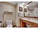 Neutral bathroom featuring a single sink vanity and framed mirror with towel rack at 603 S Ocean Blvd. # 1205, North Myrtle Beach, SC 29582