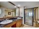 Bathroom featuring double sinks with granite counter top, and a large glass walk-in shower at 603 S Ocean Blvd. # 1205, North Myrtle Beach, SC 29582