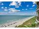 Scenic beach view showcasing the sandy shore, ocean, and skyline from a high-rise building at 603 S Ocean Blvd. # 1205, North Myrtle Beach, SC 29582