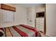 Neutral bedroom with dresser and TV; window with privacy blind at 603 S Ocean Blvd. # 1205, North Myrtle Beach, SC 29582
