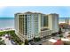 Aerial view of the high-rise building with balconies, showcasing its proximity to the ocean and local attractions at 603 S Ocean Blvd. # 1205, North Myrtle Beach, SC 29582