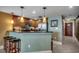 A cozy kitchen with stainless steel appliances, granite counters, and bar seating is perfect for entertaining at 603 S Ocean Blvd. # 1205, North Myrtle Beach, SC 29582