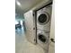 Convenient laundry closet featuring a stacked washer and dryer unit near the dining area at 603 S Ocean Blvd. # 1205, North Myrtle Beach, SC 29582