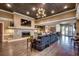 Elegant common area featuring a stone fireplace, large sofa, and coffered ceilings at 603 S Ocean Blvd. # 1205, North Myrtle Beach, SC 29582