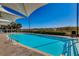 Resort-style outdoor pool with lounge chairs, ocean view, and shade canopy for residents and guests at 603 S Ocean Blvd. # 1205, North Myrtle Beach, SC 29582