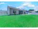 Large grassy backyard featuring a screened porch and a white picket fence at 617 Chiswick Dr., Conway, SC 29526