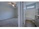 Bathroom and bedroom view that shows a shower/bathtub combination and connecting bedroom space at 617 Chiswick Dr., Conway, SC 29526
