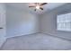 Cozy bedroom with a ceiling fan and a window, creating a relaxing space for rest and rejuvenation at 617 Chiswick Dr., Conway, SC 29526