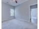 Serene bedroom bathed in soft light, featuring plush carpeting and a window, promising a tranquil retreat at 617 Chiswick Dr., Conway, SC 29526
