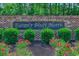 Beautiful community sign with lush greenery and vibrant flowers at 617 Chiswick Dr., Conway, SC 29526