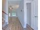 The entryway features hardwood floors with an adjacent closet and view of the living room at 617 Chiswick Dr., Conway, SC 29526