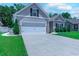 This home features a well manicured lawn, two car garage, and neutral paint at 617 Chiswick Dr., Conway, SC 29526