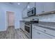 Close-up of the kitchen featuring stainless steel appliances and granite countertops at 617 Chiswick Dr., Conway, SC 29526
