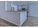 The kitchen has granite counters, stainless appliances, and gray shaker cabinets at 617 Chiswick Dr., Conway, SC 29526