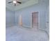 View of the carpeted primary bedroom featuring a walk-in closet and access to other areas of the home at 617 Chiswick Dr., Conway, SC 29526