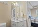 Half bathroom features a white vanity, framed mirror, and toilet at 6253 Catalina Dr. # 534, North Myrtle Beach, SC 29582