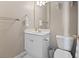 Half bathroom featuring a white vanity, mirror, toilet, and towel rack at 6253 Catalina Dr. # 534, North Myrtle Beach, SC 29582