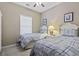 Bedroom featuring two twin beds with matching blue and white bedding, a ceiling fan and a window at 6253 Catalina Dr. # 534, North Myrtle Beach, SC 29582