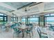 An inviting dining room with ocean views, plenty of light, and blue accents at 6253 Catalina Dr. # 534, North Myrtle Beach, SC 29582