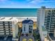 Exterior view of a beachside building complex featuring coastal views and parking at 6253 Catalina Dr. # 534, North Myrtle Beach, SC 29582