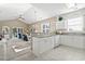 Bright, open kitchen featuring tile floor, granite counters, white cabinets, and modern appliances at 6253 Catalina Dr. # 534, North Myrtle Beach, SC 29582