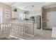 Cozy kitchen with white cabinetry, granite countertops, stainless steel appliances, and breakfast bar seating at 6253 Catalina Dr. # 534, North Myrtle Beach, SC 29582