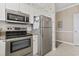 Close-up of the kitchen area, showcasing stainless steel appliances and ample storage space at 6253 Catalina Dr. # 534, North Myrtle Beach, SC 29582