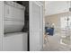 A laundry closet with stacked washer and dryer is conveniently located near the living area at 6253 Catalina Dr. # 534, North Myrtle Beach, SC 29582