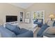 Comfortable living room featuring a balcony, TV, neutral tones, and vaulted ceiling at 6253 Catalina Dr. # 534, North Myrtle Beach, SC 29582