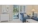 Living room with sliders to balcony with peaceful views, comfy seating, and white accents at 6253 Catalina Dr. # 534, North Myrtle Beach, SC 29582