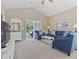 Bright living room with high ceilings, plush seating, and sliding doors to a balcony at 6253 Catalina Dr. # 534, North Myrtle Beach, SC 29582