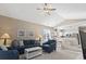 Open living space with vaulted ceiling, leading into kitchen and dining area, with comfortable blue seating at 6253 Catalina Dr. # 534, North Myrtle Beach, SC 29582