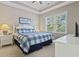 Relaxing main bedroom featuring tray ceiling, large window, and bright, modern decor at 6253 Catalina Dr. # 534, North Myrtle Beach, SC 29582